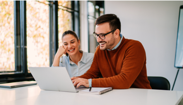 hr leaders using the Paycor hcm cost savings calculator on a computer
