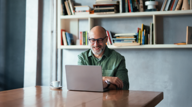 HR professional smiling after fixing payroll mistakes