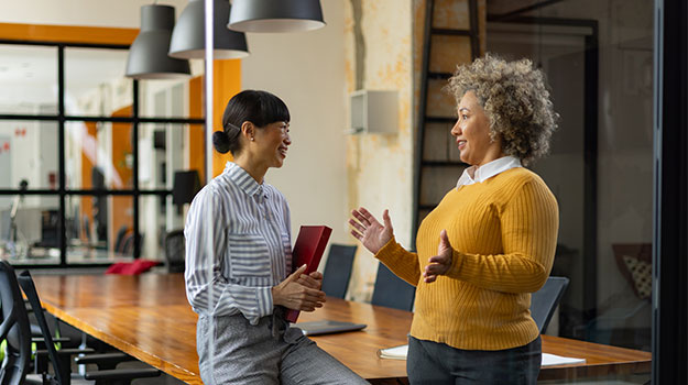 HR professionals discussing year-end payroll