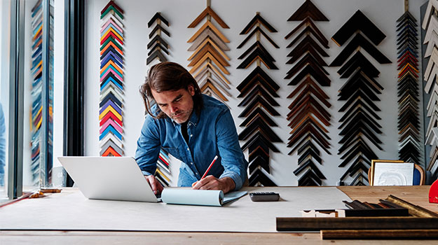 business owner making a list of tax write offs for llc