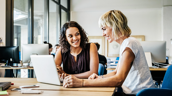 two HR professionals filling out an employee reference letter template PDF