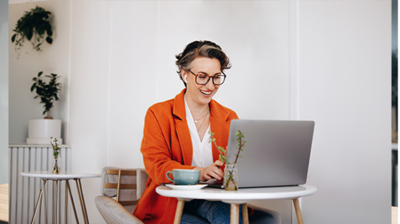 business owner writing a business growth plan on a computer