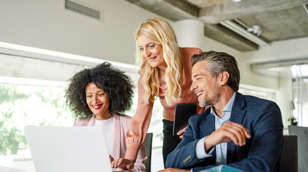 HR professionals looking at computer