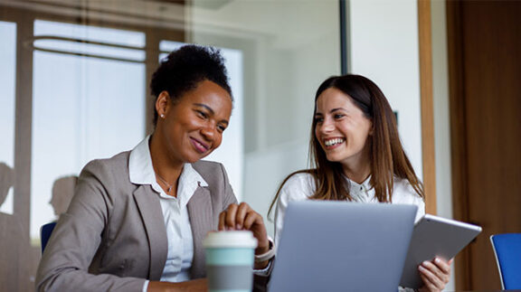 HR professionals looking at laptop