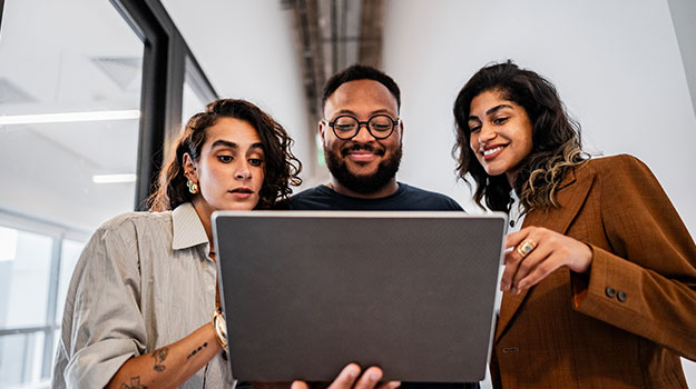 HR professionals looking over computer