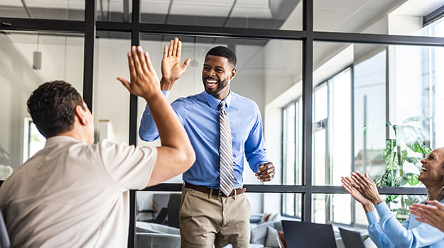 HR professionals high fiving