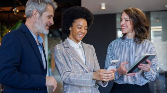 Three colleagues discussing generative AI at work